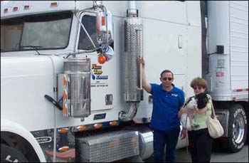 Daisy with her driver, Dave, and foster Mom, Debbie Reed, as they were getting ready to leave New Orleans. Now that’s a big rig in the background to carry a very little girl all the way to Arizona to CastOff Cockers’ Diana Kraus.